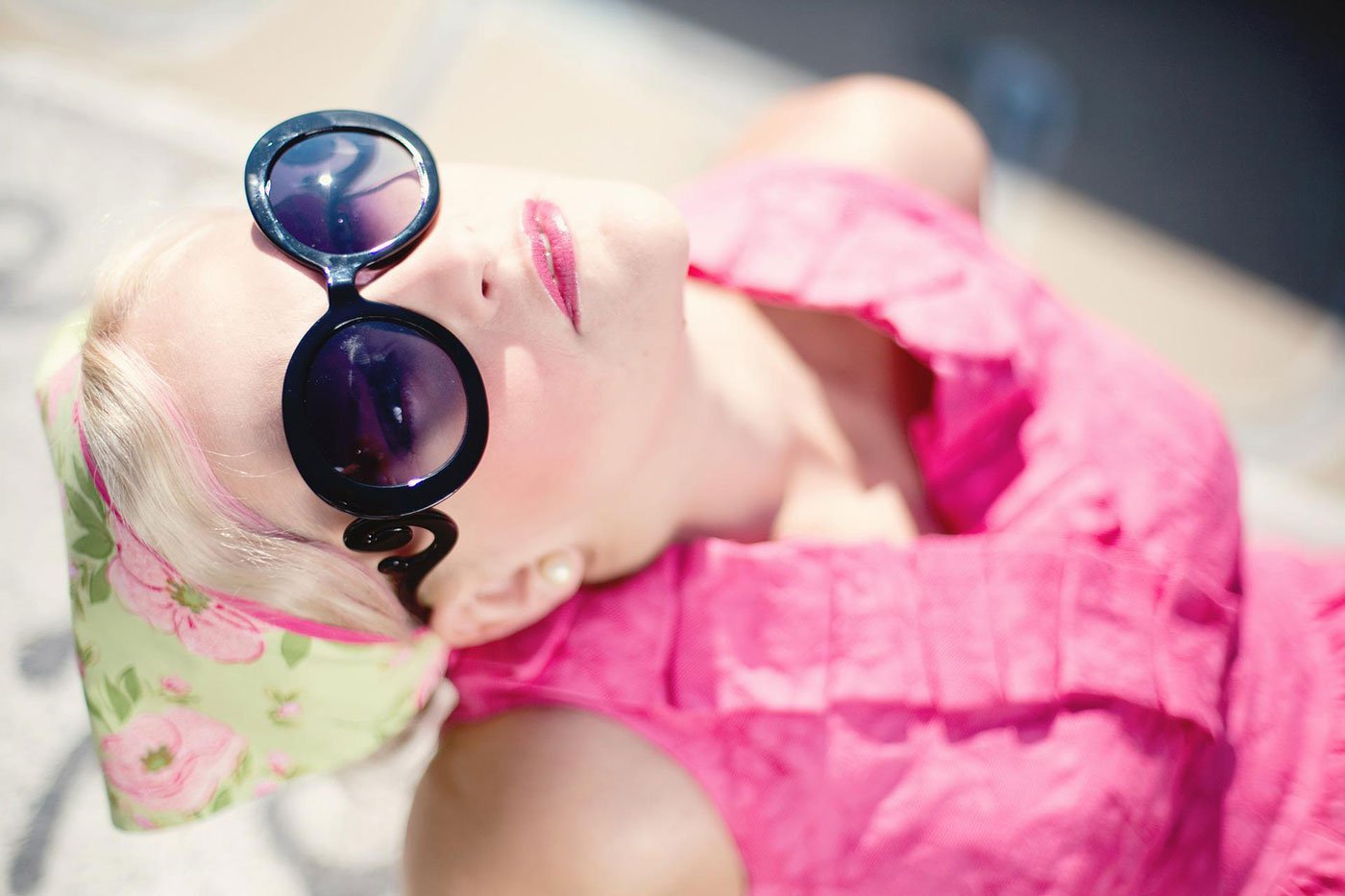 A woman enjoying the sunshine wearing sunglasses